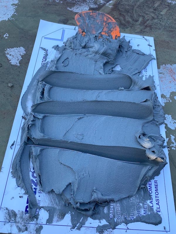 Belzona 1161 applied to mounting plate for cell tower antenna